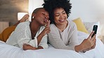 Happy, friends and selfie with phone in bed with a smile, relax and funny during a luxury vacation in a hotel room. African american women having fun with social media post on a 5g mobile smartphone
