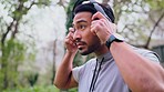 Music motivation, running man and nature fitness training in the morning, audio podcast for workout in summer and exercise with headphones. Asian athlete runner streaming radio for cardio health
