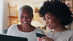Payment, credit card and friends online shopping on a laptop for discount or sale on a digital fintech website at home. Ecommerce, happy and excited African women on the sofa banking on the internet