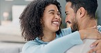 Couple, love and hug while sharing a kiss, commitment and happy marriage while bonding and spending quality time in interracial relationship. Laughing man and woman celebrate anniversary or good news