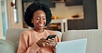 Woman texting on phone and watching laptop movie, relax on a sofa in living room, happy and cheerful. Social media, communication and internet chat, laughing at a funny meme, enjoy streaming service 