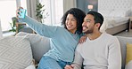 Happy couple, phone selfie and smile on living room sofa for love, relax and fun together. Young man, woman and people in relationship on lounge couch taking mobile photos for social media online