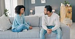 Couple, sad and fight with a man and woman talking about divorce, stress or a marriage problem during a conflict at home. Angry, frustrated and dating with a young male and female having an argument