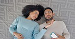 Phone, music earphones and couple on bonding on floor in house or home and listening to relax podcast. Top view, happy smile and interracial black woman and asian man love on radio mobile technology