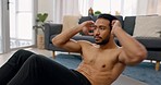 Exercise, workout and fitness with a man doing sit ups in the living room of his home for health and wellness. Motivation, training and healthy with a male athlete exercising his body in a house