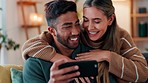 Love, relax and ecommerce couple on smartphone with hug embrace with kiss from girlfriend. Caring people in interracial and romantic relationship enjoy online shopping together in home.