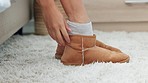 Woman, shoes and walking on carpet in bedroom after waking up, sleeping or bed rest. Relax, morning and female ready to start day tasks, challenges or work goal with legs or feet in footwear on rug

