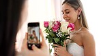 Phone photography of bride, bouquet and wedding celebration happy, love and smile in luxury designer dress at hotel. Rich girl, smartphone and flowers photo in bridal gown to celebrate marriage event