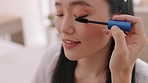 Makeup, mascara and Asian bride beauty talking with professional makeup artist, eyelashes care and wedding preparation. Cosmetics, marriage and woman ready for luxury ceremony, event or day at salon.