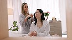 Relax, friends and talk in bedroom with hair straightener beauty preparation for social event. Young women gossip, chill and smile together in home get ready on the weekend  with fashion iron.