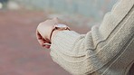 Hand, watch and time with a woman checking her wristwatch while standing outside in the city. Early, late or timing for an appointment and to stay on schedule while outdoor in an urban town alone