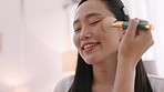 Skincare, brush and makeup artist working on Asian woman professional client. Facial, cosmetics and creative beauty entrepreneur cheek face makeup, cosmetic or luxury foundation powder at salon.


