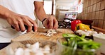 Chef hands, knife and vegetables on chopping board cooking healthy, nutrition and diet brunch food in house kitchen. Fast, chop and young man prepare organic, vegan or vegetarian dinner salad in home