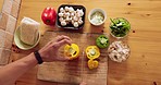 Man, hands and cut vegetables in kitchen or restaurant for cooking health food or asian cuisine stir fry. Top view of chef, nutritionist or dietician and wellness lunch salad on wood board for dinner