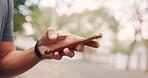 Phone, fitness and app with the hand of a man tracking his progress while on a training workout for exercise, health or sports. Mobile, hands and sport with a male athlete checking his routine online