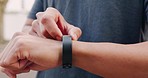 Exercise, health and smartwatch of a man training for a running marathon in an outdoor street. Closeup of a athlete with a healthy, wellness and active lifestyle setting his digital fitness wristband