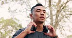 Headphone, fitness and nature running man, outdoor or park listening to motivation music. Health, workout and sports exercise runner, marathon training and radio headphones audio podcast wellness run