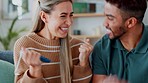 Happy couple celebrate pregnancy test results in home lounge with love, hug and kissing. Young woman, smile man and surprise people excited for good news, fertility and pregnant announcement together