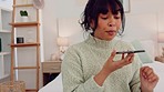 Phone call, fight and angry girl on a mobile conversation while sitting in her bedroom at home. Upset, annoyed and young latin woman having an argument and speaking on a smartphone or technology.