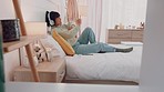 Headphones, music and woman dance on bed in bedroom home, streaming audio or radio. Smile, relax and happy female from Indonesia on headset dancing, singing and listen to song, sound or web playlist.