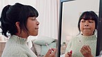 Mirror, beauty and makeup by woman, happy and excited to apply lip gloss, playing, flirt and wink while getting ready. Black female enjoying free time and new lipstick color in her bedroom at home