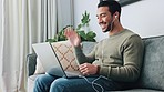 Video call, talking and computer communication of a man using technology in a home living room sofa. Remote worker on a work online conversation with earphones working on the internet and web