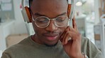 Headphones, music streaming and black man listening and hearing a song and dance. Web radio listen of a worker to relax while dancing in the office to take a mind break to feel free and calm 