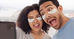 Face, beauty and under eye mask with a couple taking a selfie with a phone while joking and playing in the bathroom at home. Skincare, health and humor with a man and woman having fun and recording