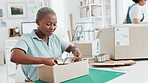 Startup, shop and entrepreneur packing a box for an order of products for shipment or delivery. Black business owner preparing a retail package for courier with her corporate partner in their office.