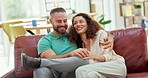 Love, work and affection, startup couple hug on modern office sofa. Married business partners, happy woman and man from Greece talking on couch. Husband and wife team relax after working together.