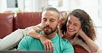Couple, laptop and laughing at online comic video, meme or joke while talking, bonding and relaxing on sofa in lounge at home. Happy man and woman surfing web or internet for entertainment in russia