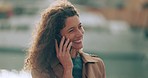Woman, happy and phone call with communication, conversation and networking with smile by ocean. Girl smiling for trip in Portugal on 5g smartphone network, contact us and travel success feedback