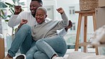 Dance, excited and a happy black couple in home celebrate buying property sitting on living room floor. Homeowners, man and woman laugh and plan boxes and furniture, success moving in to apartment  