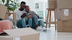Couple, home and floor with coffee after moving to new building, flat or apartment. Man, black and happy together in home, living room or house after move with furniture, boxes and plants in Atlanta