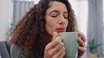 Woman, coffee and hands blow, steam and smell aroma of fresh mug in the morning in house. Lady, cup and tea relax at breakfast to start day in home with hot drink for energy with handheld movement