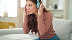 Woman, phone or music headphones on relax sofa in house or Singaporean home living room. Smile,enjoy or happy student with mobile technology for podcast, dance radio or audio playlist app in lockdown