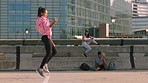 Street performance, team dance and woman training for professional competition, moving to music and doing battle with group in urban city. Girl dancer dancing in road with friends together in town