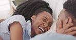 Morning, love and black couple relax in bed bonding, talking and cuddle together. Affection, relationship and loving black man and woman laughing, speaking and have conversation in bedroom on weekend