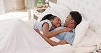 Love, morning and black couple relax in bed together, talking, speaking and having conversation. Affection, happiness and black man and woman in relationship laying, cuddle and bonding in bedroom