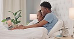 Black couple, watching movie and laptop, bed and love, spending quality time and bonding, streaming online with 5g network. Black woman, man and relationship, technology and film, together in bedroom