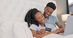 Bed, credit card and couple online shopping for ecommerce, website application or finance management at home. Rich, wealth and black people relax in bedroom pc banking, credit score or easy payment