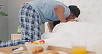 Black couple, morning kiss and breakfast in bed for love, care or anniversary surprise at home. Happy African American man waking woman up in bedroom for early healthy meal in romance for special day