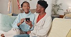 Food, phone and couple ordering lunch on a mobile app from the living room sofa of their house. African man and woman speaking about dinner on a website with a smartphone on the couch of their home