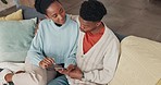 Phone, social media and communication with a black couple on a sofa to relax in their home together from above. Love, mobile and internet with a man and woman browsing the internet in the living room