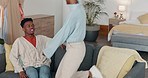 Black couple, relax and love on sofa in living room taking a break together in relationship bonding at home. Happy African American man and woman relaxing on a couch with smile for quality time