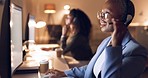 Call center, support and business woman at night, working on computer, overtime or evening shift. CRM, help and black woman talking to customer on headset. Consulting agent on customer service call