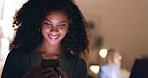 Social media, phone and happy woman typing on a dating app or website for a love connection and romance. Smile, relaxed and young woman texting, chatting and online dating in a dark night at home