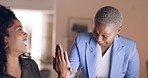 High five, comic and business women speaking about a funny story in an office together at night. Young, comedy and happy African employees in communication with support while working overtime