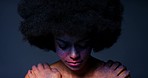Woman, afro and face with creative makeup against a dark mockup studio background. Portrait, beauty and fantasy cosmetics with female with art on her skin with a shadow, silhouette and art on person