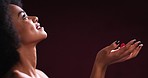 Beauty, afro and black woman with rose petals mockup in studio for valentines day romance or glamour. Sensual, passionate and skincare of African girl looking seductive against a dark background